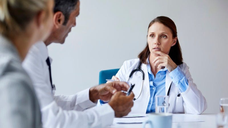 Concerned female doctor in meeting