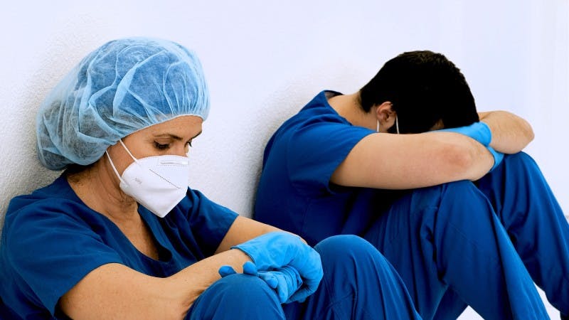 two doctors in hallway sad pensive tired overworked residents residency