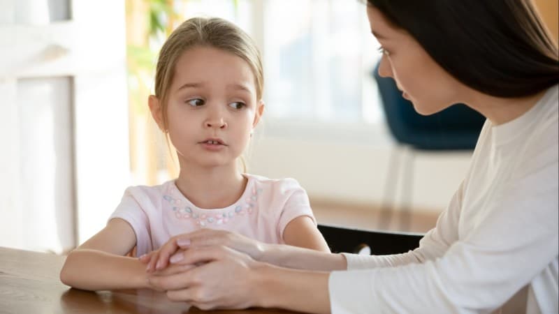 Little girl looking distressed and talking to mom Adverse Childhood Experiences (ACE) can result in serious physical and psychological conditions throughout life, according to studies. 